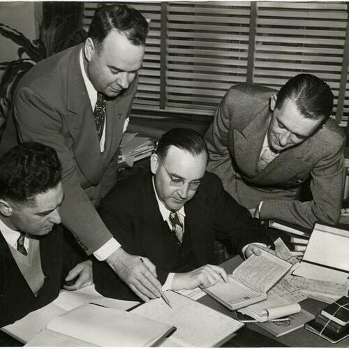 [District Attorney Pat Brown look over records of S.F. abortionist Inez Brown Burns case in 1945]