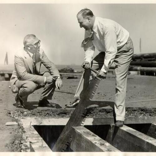 [State Director of Public Works Earl Lee Kelly and engineer C. H. Purcell planning for the construction of the San Francisco-Oakland Bay Bridge]