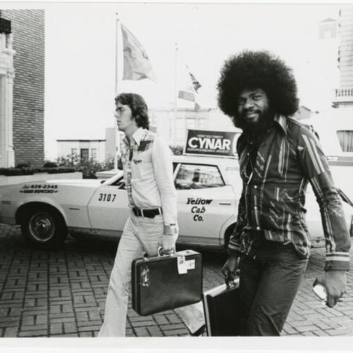 [Billy Preston (right) and Tom Scott(?) outside the Mark Hopkins Hotel]