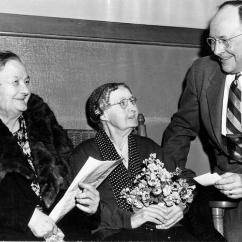 [Olivette Walsh and Mary Jane Haller, of the Laguna Honda Home, accepting an invitation to a Mother's Day breakfast from Bradford Bosley, president of the South of Market Boys]