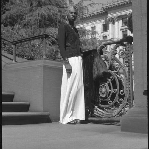 Sylvester standing on steps of Flood Mansion