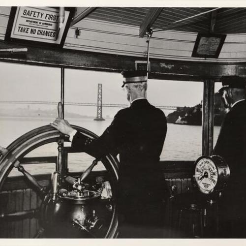 [View of the Bay as seen from the pilot house of a ferryboat, Yerba Buena Island, the San Francisco skyline and in the forefront, the Bay Bridge]