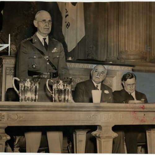 Lieutenant General John L. Dewitt standing with San Francisco Mayor Rossi (center) and Rear Admiral J. W. Greenslade