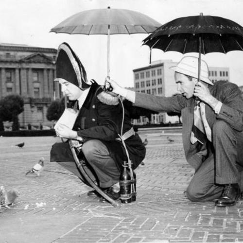["Admiral Baron Ahab von Muller and his man Saturday, George Dusheck" on a pigeon feeding expedition in Civic Center plaza]