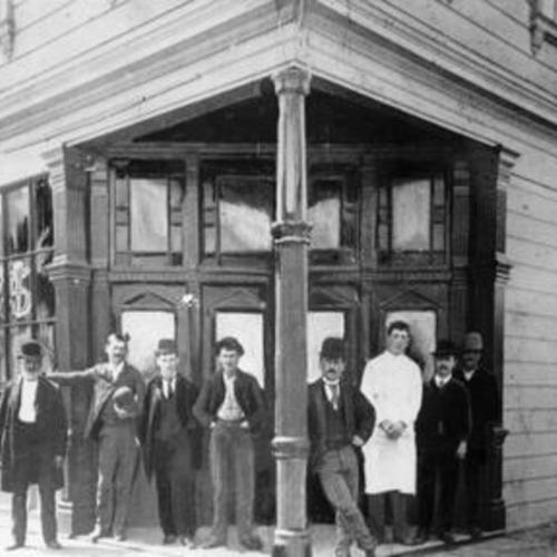 [Men standing outside a Bryant Street saloon]