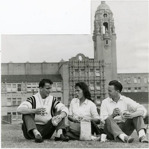 [Mission High School students Dale Scholzen, Phyllis Cassidy and Ed Johnston eating lunch in Mission Park]