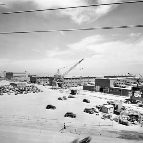 [Hunters Point Naval Drydocks, San Francisco - view showing new shops and cranes under construction]