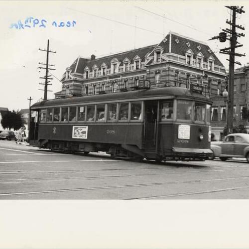 [Geary and Sixth avenue looking southeast at outbound Muni "B" car 208 passing French Hospital]