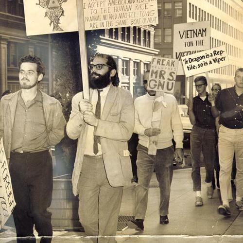 [Poet Allen Ginsberg marching with a group of pickets protesting U.S. policies in Vietnam]