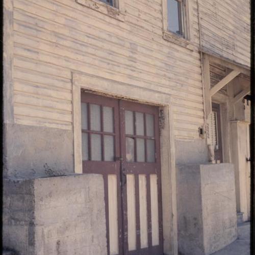 Withered exterior of building and garage doors