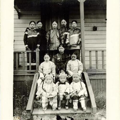 [Chinese women and children posing for a photo]