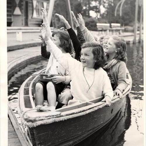 [Girls riding on canoe, Y.M.C.A. Day Camp at Stow Lake]