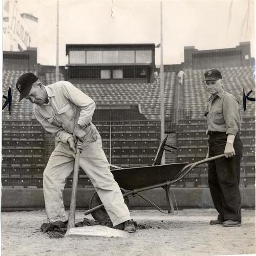[Harvey Spargo and Shorty Schurr removing home base from the field at Seals Stadium]