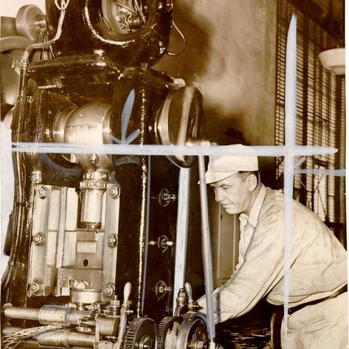 [Ed McGee operating coin manufacturing machinery at the U. S. Mint in San Francisco]