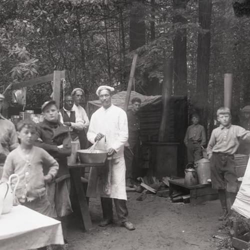 People preparing food outside at Camp McCoy