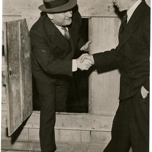 [Ralph Stackpole (right) shaking hands with Timothy Pfleuger]