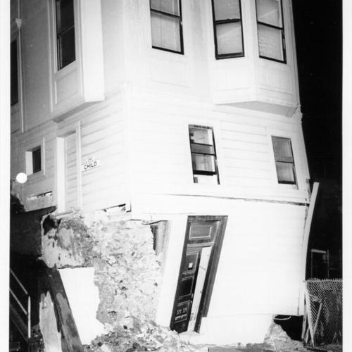 [Badly damaged building in state of collapse at Grant and Lombard streets on Telegraph Hill]