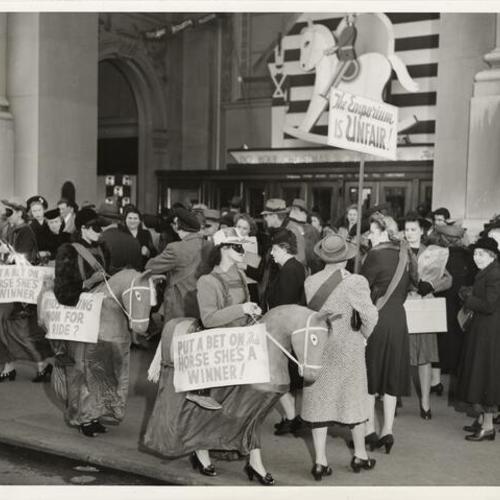[Striking employees of the Department Store Employes Union picketing in front of the Emporium]