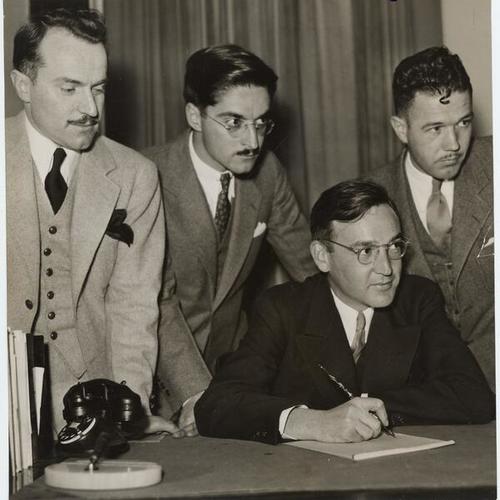 [Edmund G. Brown (seated) with Ralph B. Potts, Ralph B. Weitheimer and Francis H. De Witt]