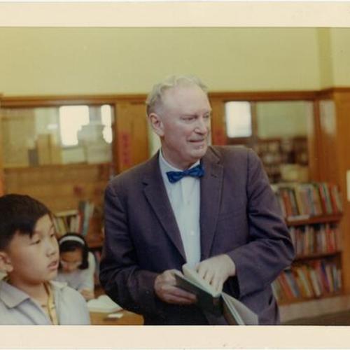 [Stu Boland, staff member of the San Francisco Public Library with an unidentified child]