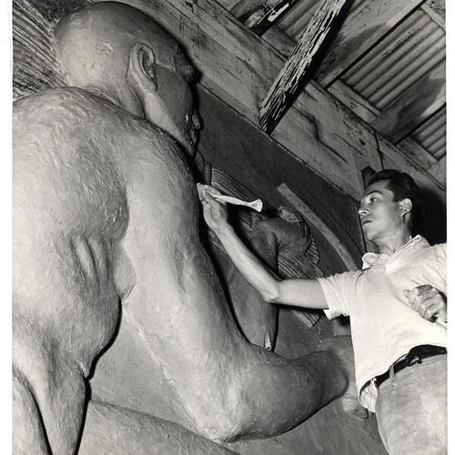 [Sculptor David Slivka working on bas relief "Abundance," Golden Gate International Exposition on Treasure Island]