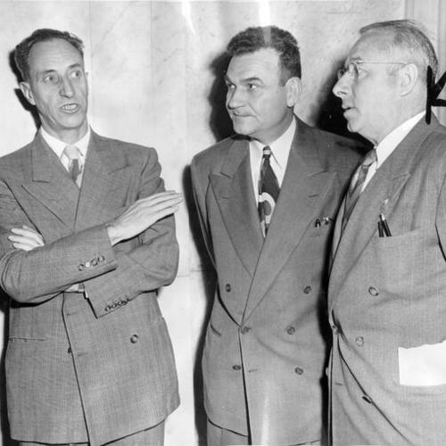 [Harry Bridges, with J.W. Robertson (center) and Henry Schmidt (right), in the San Francisco Federal Building before pleading innocent to federal indictment charges]