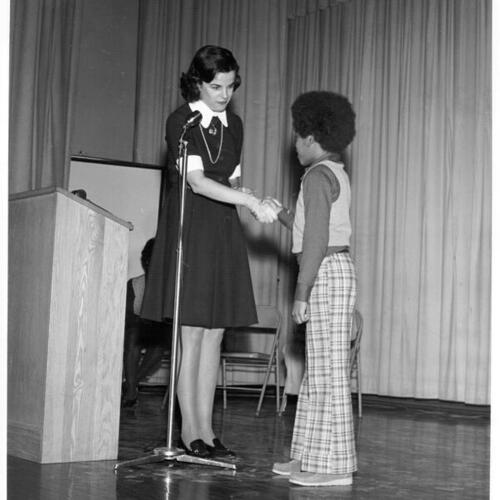 [Dianne Feinstein shaking hands with new student officer at Sir Francis Drake Elementary School]