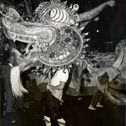[Dragon dancing through the streets during the Portola Festival and Pageant in Chinatown]