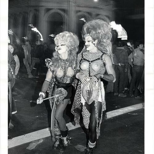 [Two men dressed in drag costumes posing on Castro street]