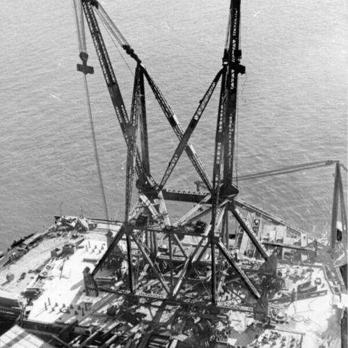 [Aerial view of creeper truss construction for Golden Gate Bridge]