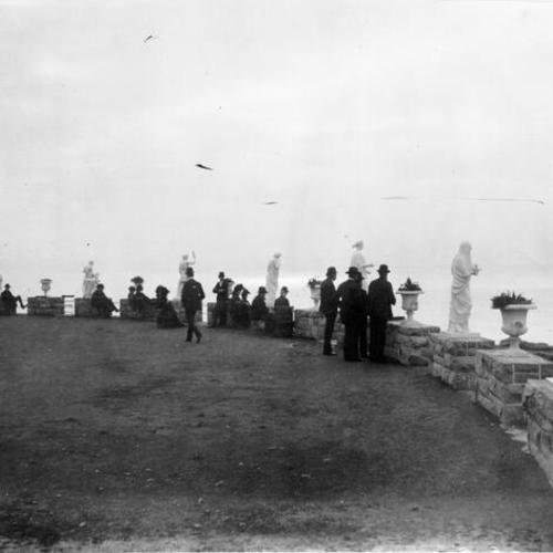[Group of people looking out at the ocean from Sutro Heights]