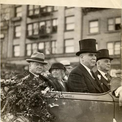 [President Herbert Hoover riding in car with Mayors James Rolph, Jr. and Angelo Rossi]