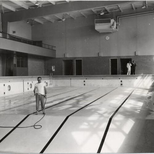 [Recreation and Park Department employees preparing Hamilton Playground swimming pool for opening]