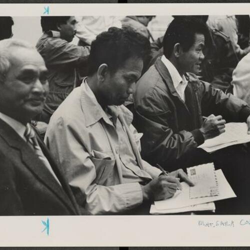 Cambodian refugees and their supporters write letters to Ronald Reagan at Cadillac Hotel