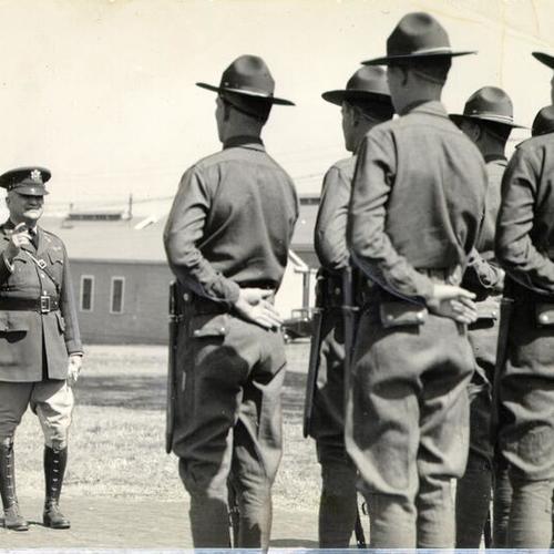 [Col. Irving J. Phillipson standing before troops at the Presidio]
