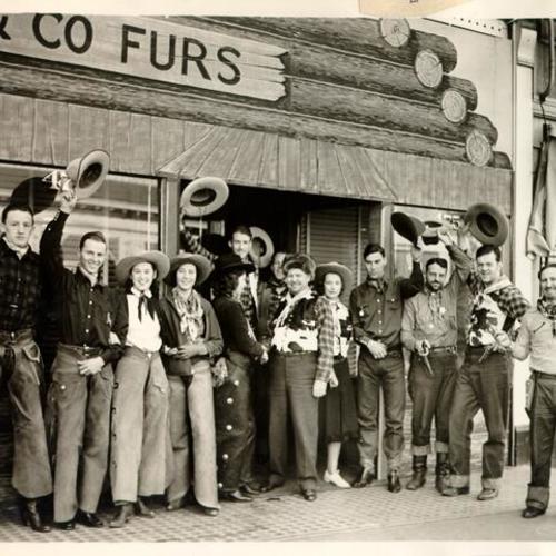 [Group of people dressed in old west costumes at Haight and Fillmore streets]