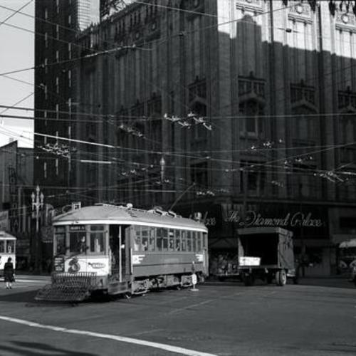 [Fourth and Market streets looking southeast at northbound Muni "F" line car 28 crossing Market street toward Stockton]