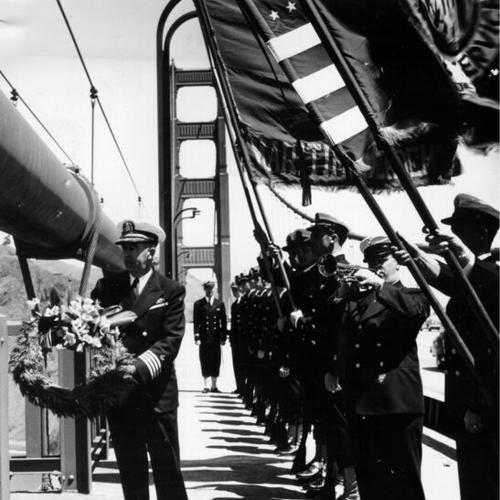 [Malcolm E. Crossman officiating memorial ceremony for merchant marines on center span of the Golden Gate Bridge"