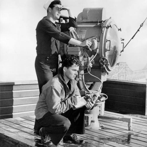[Signalmen George A. Meier and John Johnson sending and receiving messages at the Navy's lookout and signal station on Yerba Buena Island]