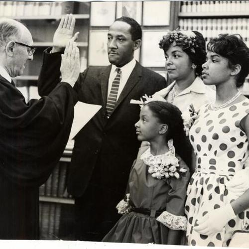 [Assistant District Attorney Cecil Poole and family in District Attorney's office]