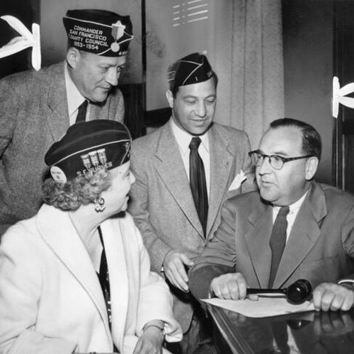 [Attorney General Edmund G. ("Pat") Brown confers with American Legion leaders on a mass initial rally at veteran's War Memorial Building]