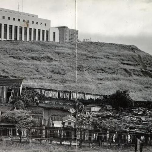 [Wrecking crew destroying squatters' homes on the U. S. Mint property at Market, Buchanan and Duboce streets]