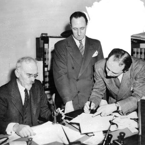 [Harry Bridges (center), with two unidentified men]