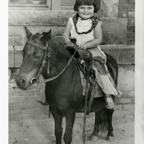 [Louise riding a horse]