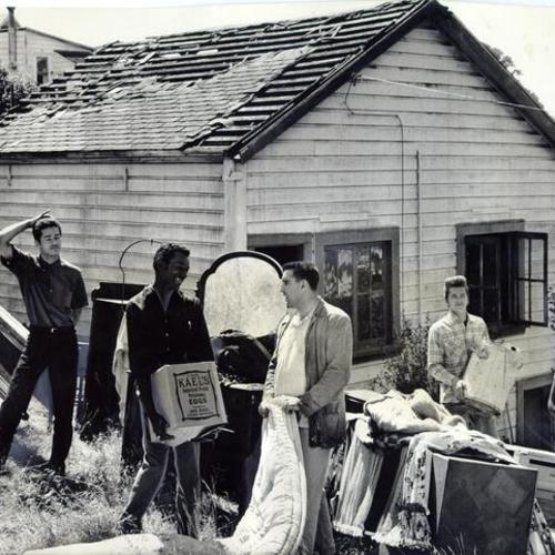 [Young volunteers helping to restore Ida Hamrin's Potrero District home after it was nearly destroyed by vandals and fire]