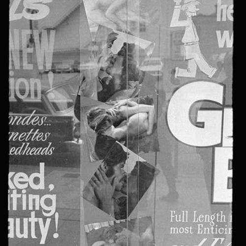 Detail view of Gayety Theatre display window with poster for "Grocery Boy" and photo collage of people in sexual poses