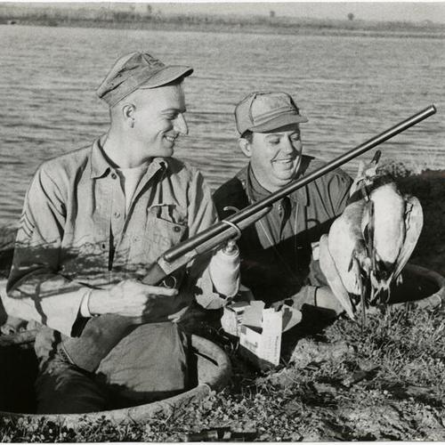 [Staff Sgt. Harry Burgus and Bill Hanna hunting duck]