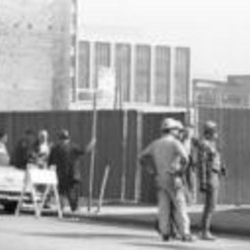 [Demolition crew and spectators next to a demolition site on the 700 block of Howard, part of South of Market Redevelopment]