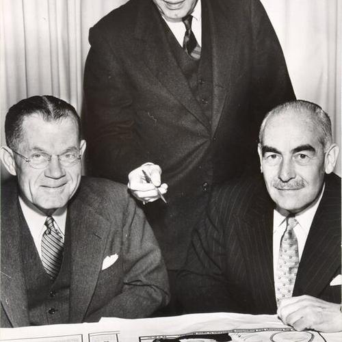 [E. C. Lipman, president of the Emporium Capwell Co., Reginald Biggs, general manager of The Emporium, and Sir Richard Burbidge, chairman and managing director of the London department store Harrods]