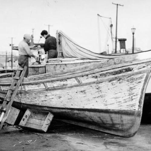 [Nick Tamato and son, Nick Jr., working on their boat at Fisherman's Wharf]